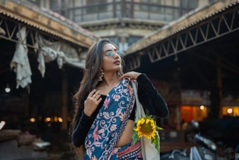 free-photo-of-a-woman-in-a-sari-standing-on-the-street